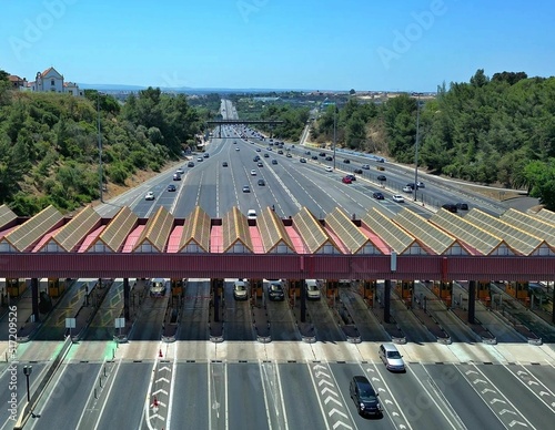 High-angle shot of cars parked on the gas station on the 25th April bridge photo