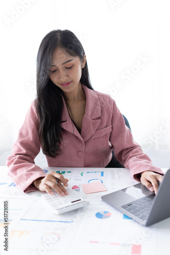 Casual busineswoman smiling at a desk in an office photo