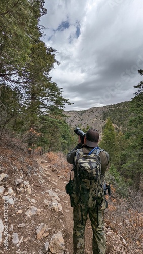 Photographer taking a picture of a tree in the Cibola National Forest, New Mexico photo