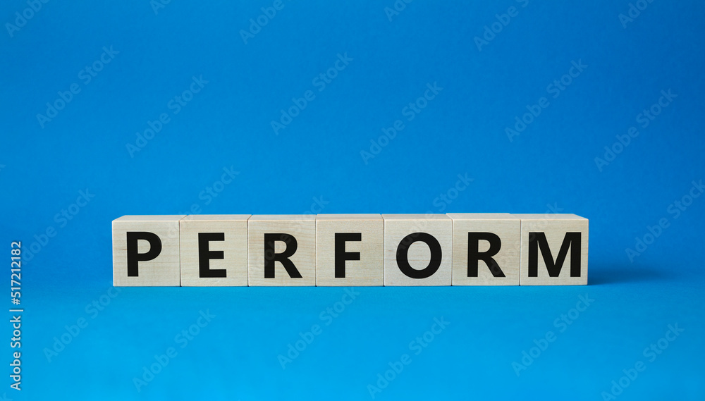 Perform symbol. Concept word Perform on wooden cubes. Beautiful blue background. Business and Perform concept. Copy space. Perform symbol. Concept word Perform on wooden cubes. Beautiful blue background. Business and Perform concept. Copy space.