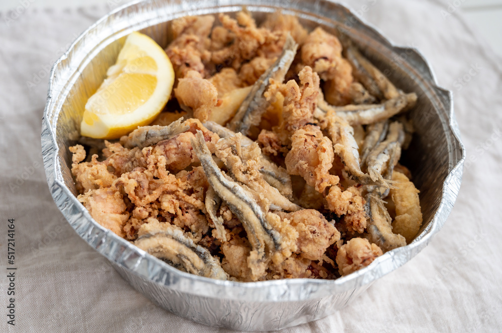 Spanish sea food, cripsy deep fried baby octopus, fish, calamari rings served with lemon