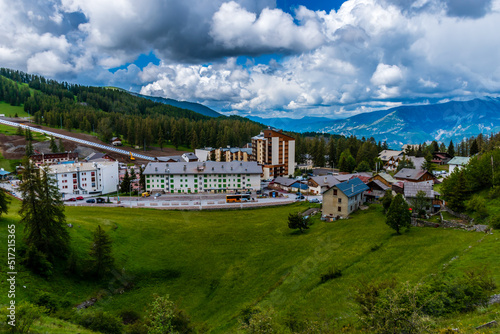 A picturesque landscape view of the French Alps mountains and the ski resort buildings on a summer day (Valberg)