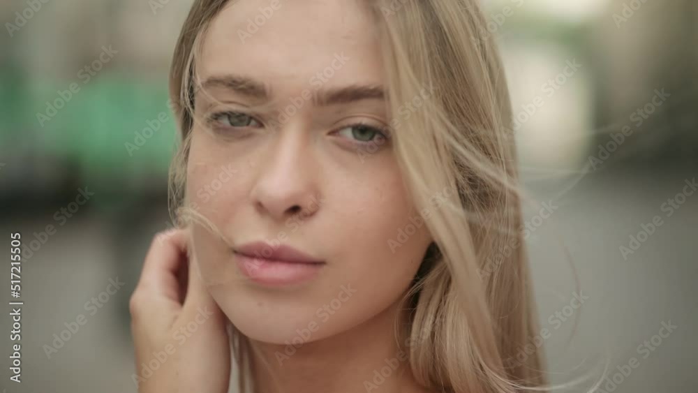 Close-up portrait of smiling girl looking at camera. Blonde hair fashion model face smiling. Portrait of joyful girl open eyes. Female nature beauty Close-up portrait of smiling girl looking at camera. Blonde hair fashion model face smiling. Portrait of joyful girl open eyes. Female nature beauty