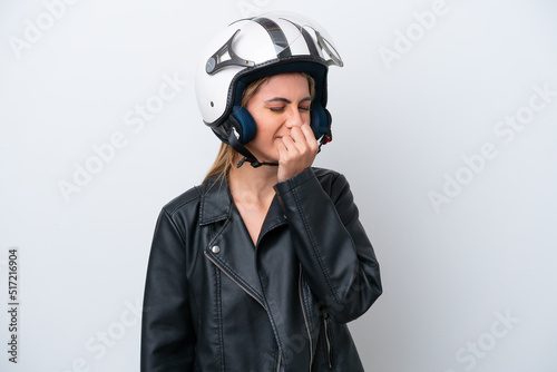 Young caucasian woman with a motorcycle helmet isolated on white background having doubts © luismolinero