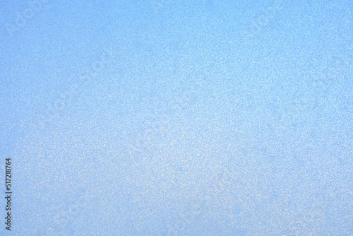 the surface of the frozen glass of blue color