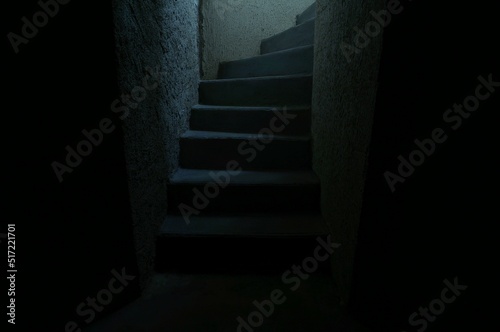 Dark stairway to the light. Creepy staircase to the light. Cellar stairs.