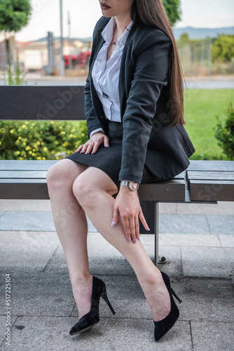 Business woman of the 21st century. A young girl works in the park. Flexible working hours.  Modern young girl.