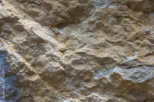 "Natural stone, structured cut, material used for construction work, decoration and finishing, close-up.