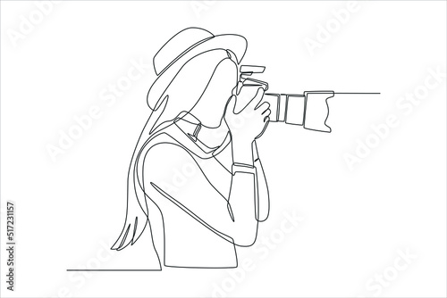 Continuous one line drawing young female photographer with camera outdoors. Modern woman concept. Single line draw design vector graphic illustration.