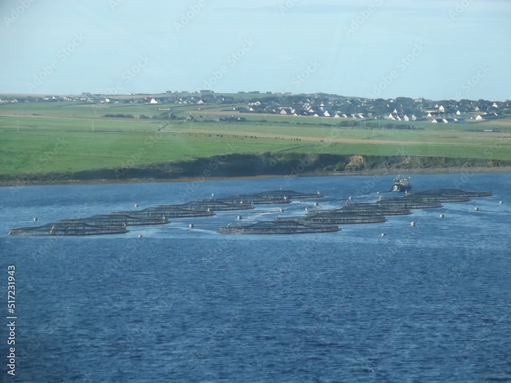 Fish farm in front of Orkney Mainland, Orkney Islands, Scotland, United Kingdom