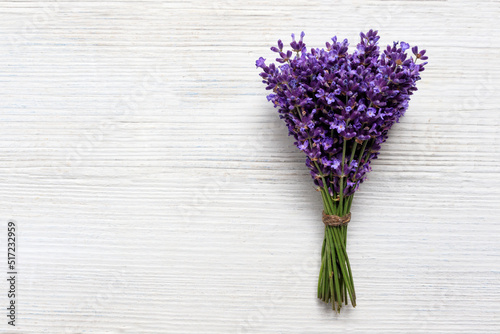 Bouquet of Fresh natural lavender on a white wooden background. Banner, top view, place for text