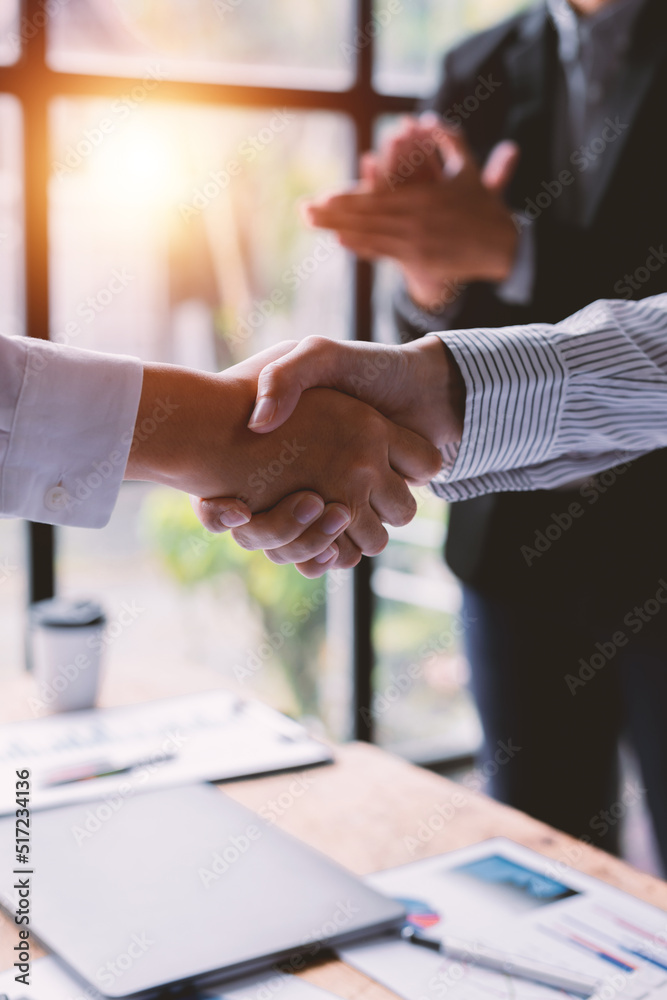 Business handshake for teamwork of business merger and acquisition,successful negotiate,hand shake, businessman shake hand with partner to celebration partnership and business deal concept Business handshake for teamwork of business merger and acquisition,successful negotiate,hand shake, businessman shake hand with partner to celebration partnership and business deal concept