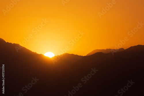 view on sunrise behind mountains at Aqaba