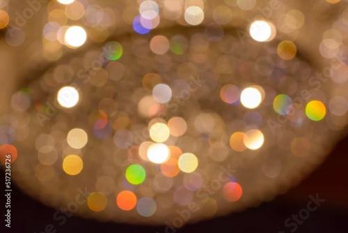 Blurred colorful bokeh lights of a chandelier photo