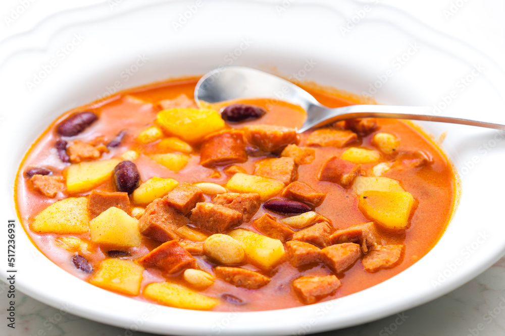 sausage goulash soup with potatoes and beans