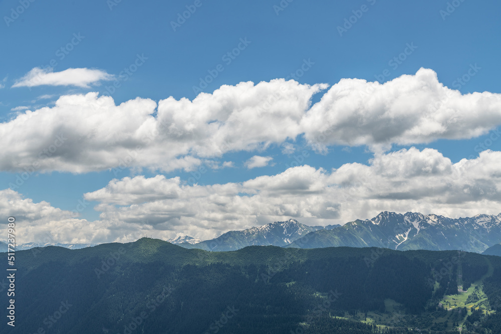 Fototapeta premium Beautiful mountain landscape. High snow covered mountains in the fog .
