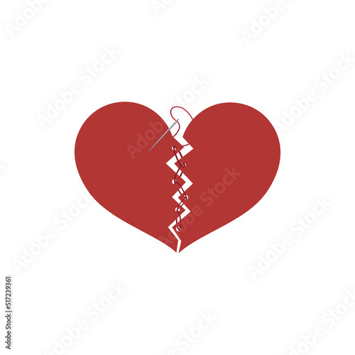 broken heart with sewing threads on a white background