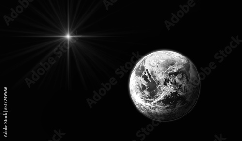 Planet Earth on black background with bright star. Black and white. Christmas Star of Bethlehem Nativity, christmas of Jesus Christ. Elements of this image furnished by NASA