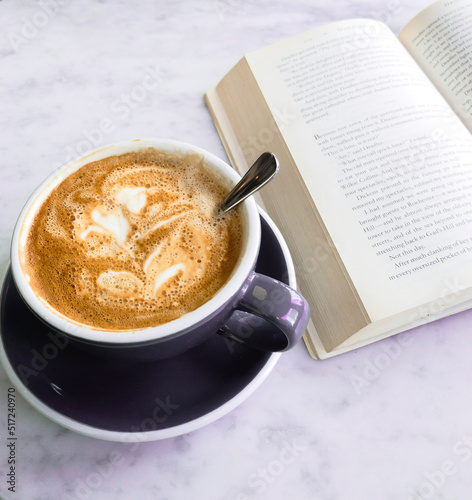 Cappuccino in the morning while reading a book