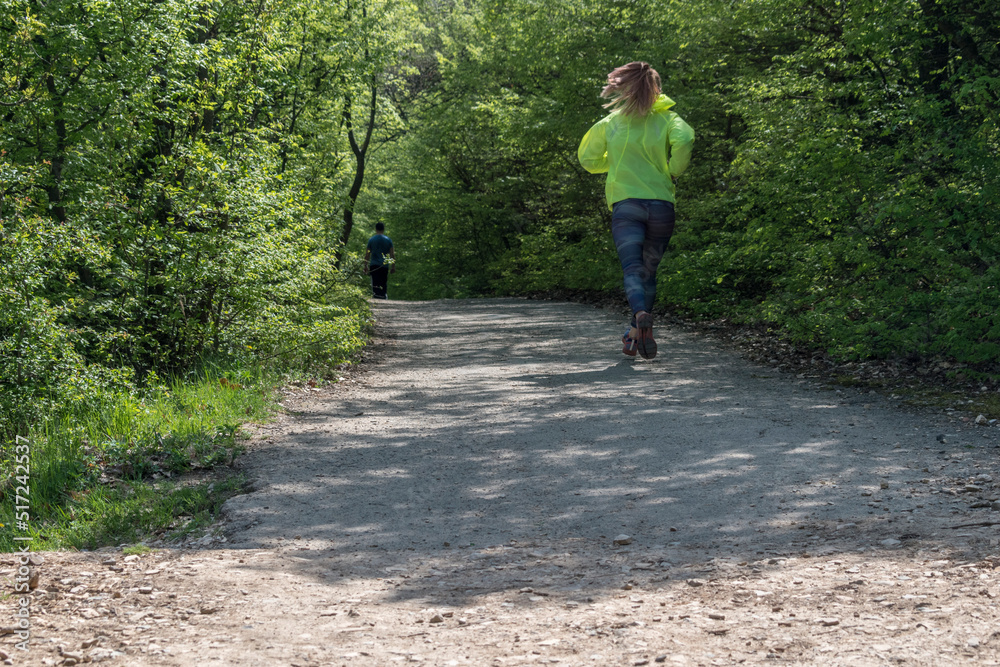 A person walks in the park in fresh air. A person walks in the park in fresh air.