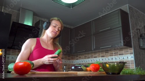 girl cutting salad in the kitchen