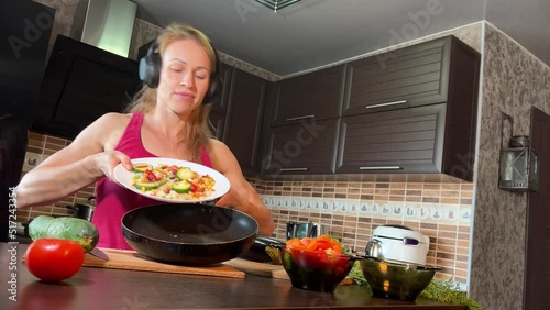 girl cutting salad in the kitchen