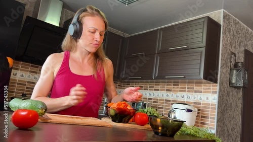 girl cutting salad in the kitchen