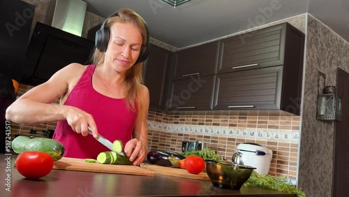 girl cutting salad in the kitchen