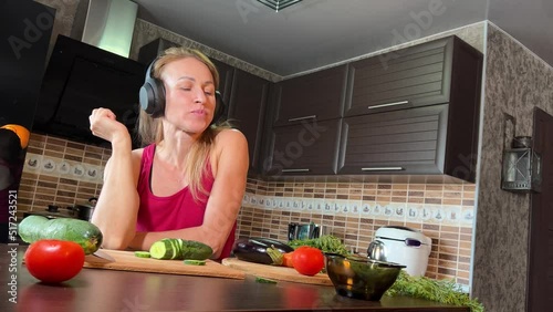girl cutting salad in the kitchen