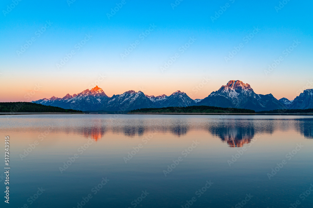 landscape of snow mountain teton under morning sunlight reflecting in the lake landscape of snow mountain teton under morning sunlight reflecting in the lake