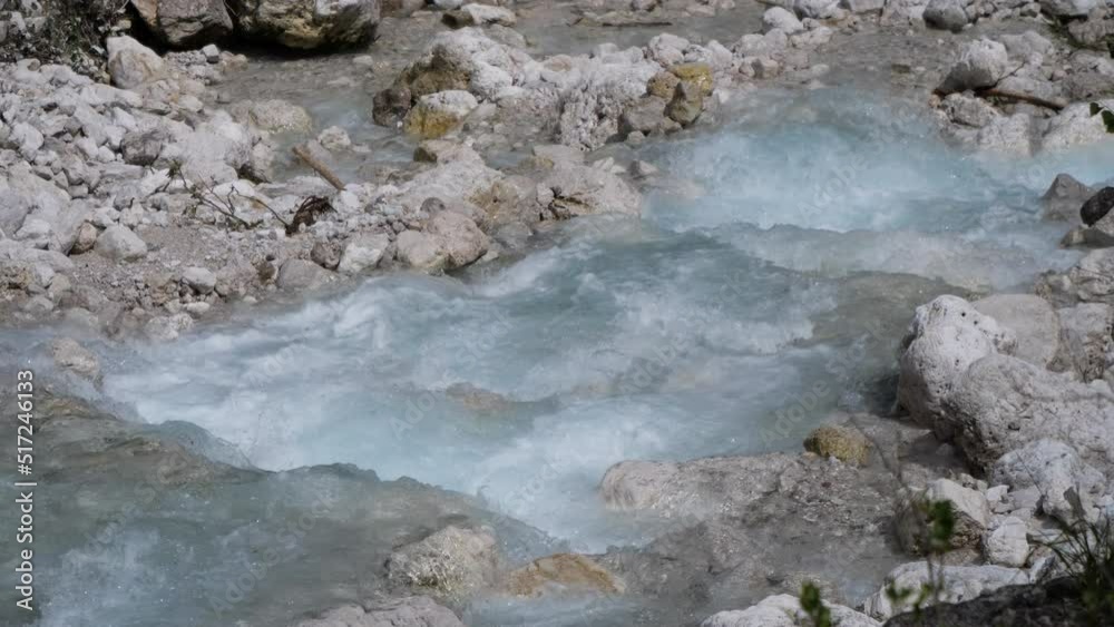 River in the Alpine mountains, Italy. Beautiful stream of clean water in nature, close-up. Drinkable water, full of mineral salts. Melting of the snow. 4k video. River in the Alpine mountains, Italy. Beautiful stream of clean water in nature, close-up. Drinkable water, full of mineral salts. Melting of the snow. 4k video.