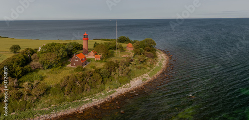 View of beautiful nature landscape of Baltic sea coast.View of the lighthouse on the Staberhuk cliffs on the island of Fehmarn, Germany, Europe.
 photo