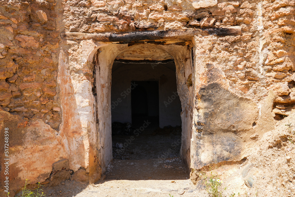 Entrance door of a troglodyte cave-house in Guadix - Home dug inside a dirt cliff in Andalusia, in the south of Spain, near the Sierra Nevada