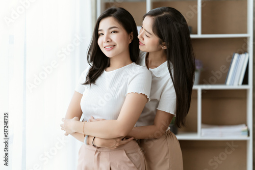 Asian lesbian couple, LGBTQ. Happy Two young Asia women showing love and romance together at home. Positive mood and moment of LGBT lesbian