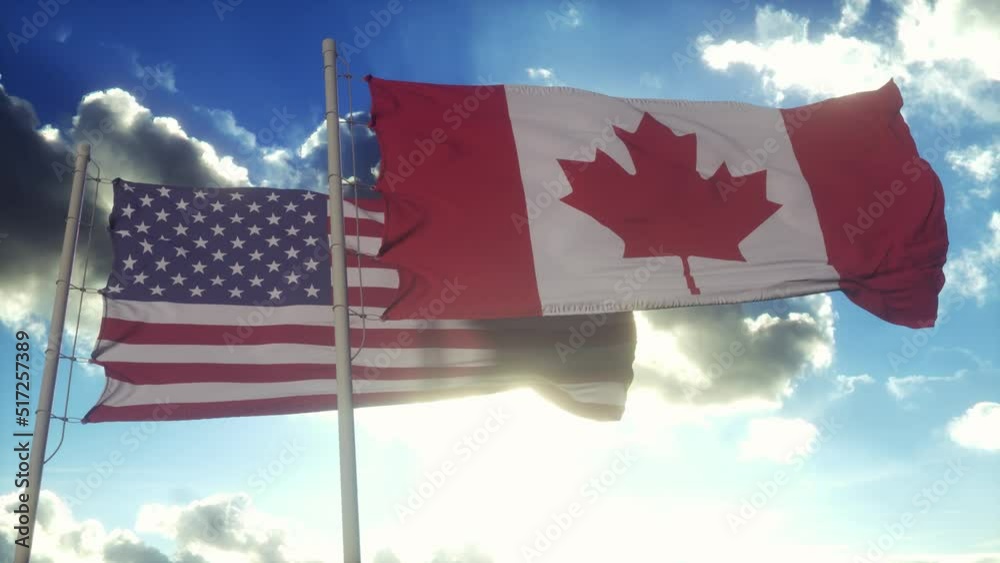 United States and Canada flag on flagpole. United States and Canada ...
