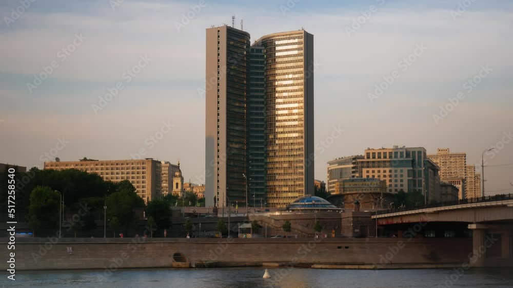 Timelapse. View of a tall building at sunset. Timelapse. View of a tall building at sunset.