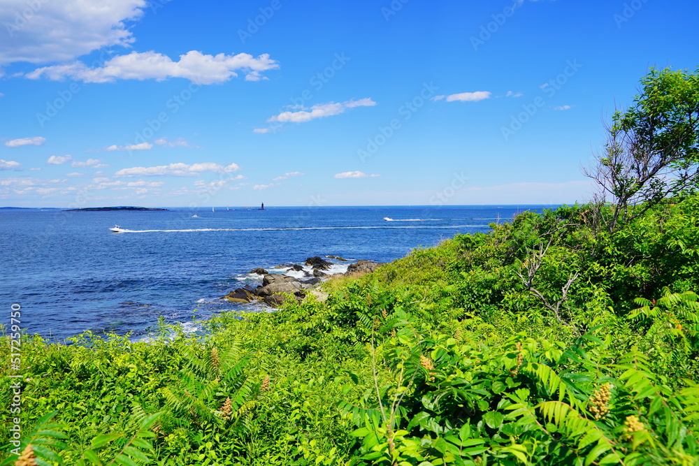 Atlantic ocean waves and rock beach along coastline in Portland, Maine, USA	