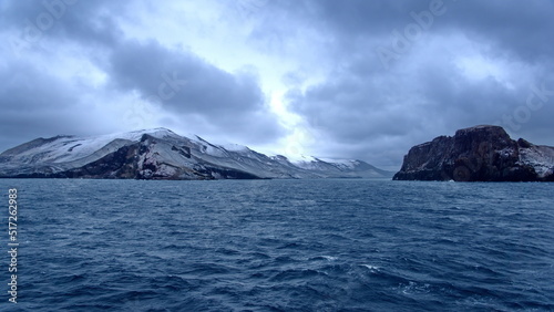 Snow dusted mountains around the pass at the entrance to the crater bay in Deception Island, Antarctica