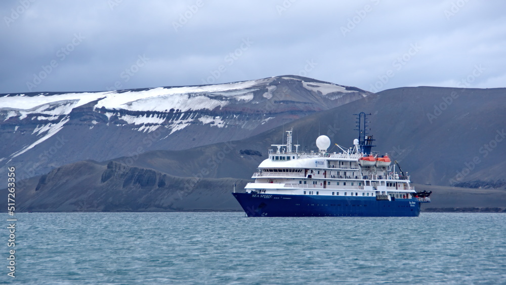 Expedition cruise ship in the crater bay in Deception Island, Antarctica Expedition cruise ship in the crater bay in Deception Island, Antarctica