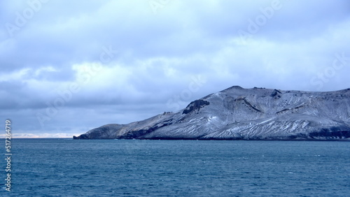 Snow dusted mountains around the pass at the entrance to the crater bay in Deception Island, Antarctica © Angela