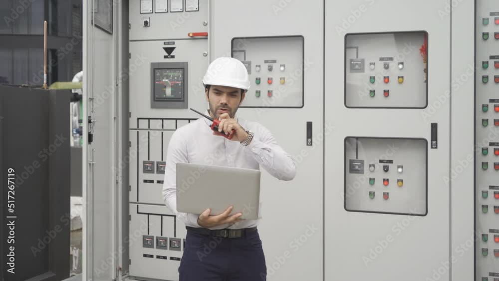 An engineer man or worker, people working in electrical room. Power energy motor machinery cabinets with panel in control or server room, operator station network in industry factory. Switchgear An engineer man or worker, people working in electrical room. Power energy motor machinery cabinets with panel in control or server room, operator station network in industry factory. Switchgear