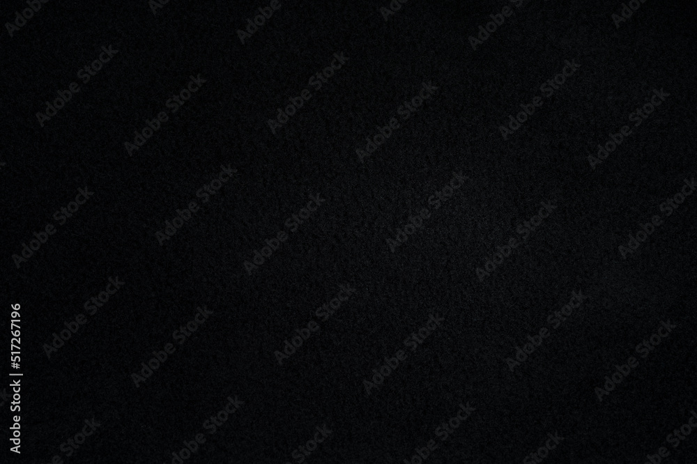 Black fleece texture and background. Close-up dark fleece fabric surface