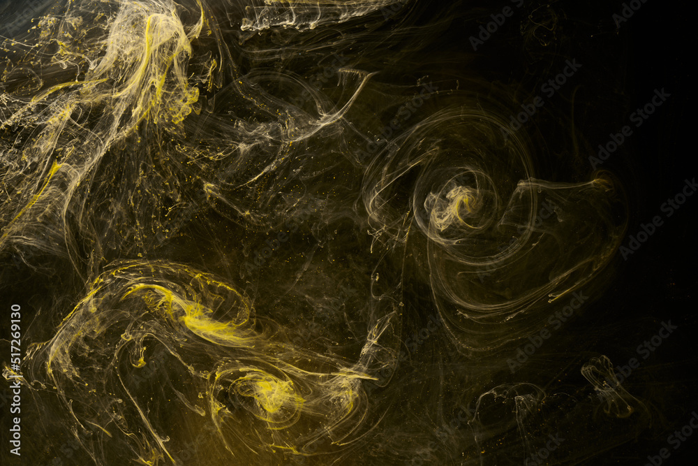 Obraz premium Liquid fluid art abstract background. Black, yellow dancing acrylic paints underwater, space smoke ocean