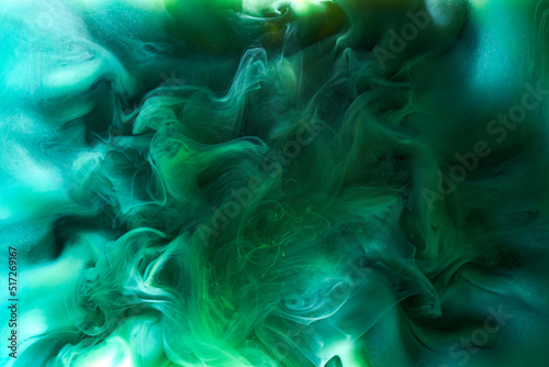 Liquid fluid art abstract background. Blue green acrylic paint underwater, galactic smoke ocean
