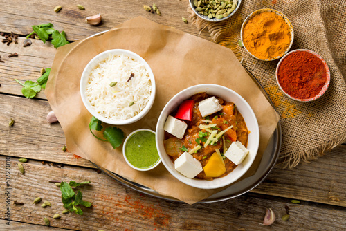 kadai chicken indian food or indian curry on wooden background top view photo