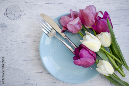 Empty plate tulip flower on wooden background