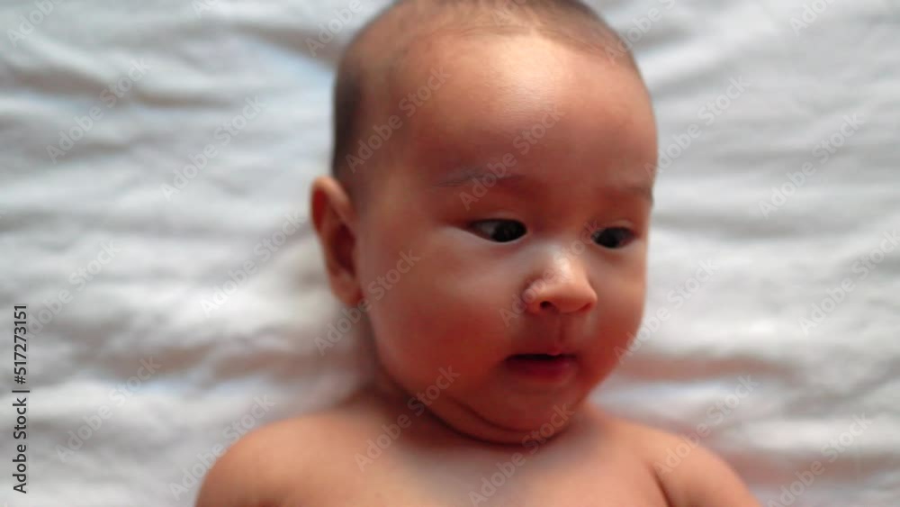Close-up view of cute asian baby's face 