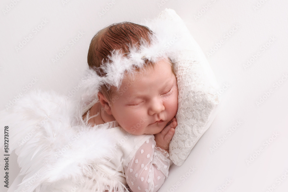 Lovely newborn resting on pillow. sleeping newborn baby girl Lovely newborn resting on pillow. sleeping newborn baby girl