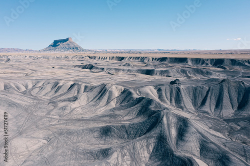 Dramatic aerial view of a sandstone mountain called Factory Butte  photo