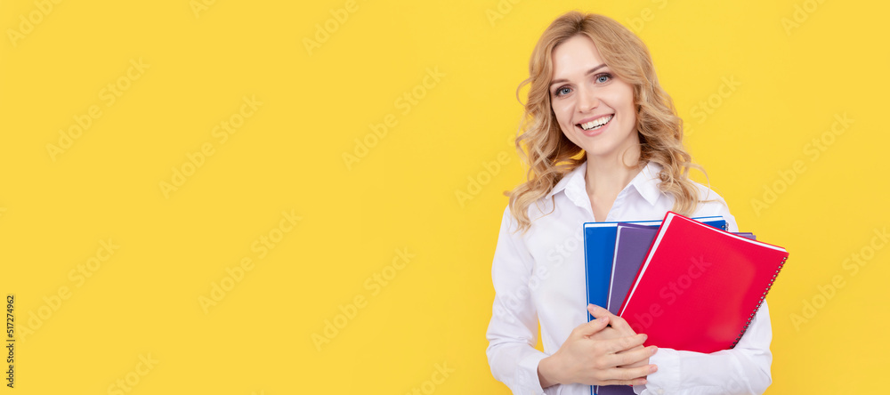 happy blonde businesswoman woman in white shirt hold notepad or notebook, education. Woman isolated face portrait, banner with mock up copy space. happy blonde businesswoman woman in white shirt hold notepad or notebook, education. Woman isolated face portrait, banner with mock up copy space.